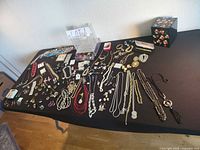 overview of entire jewelry lot on table