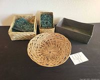 Group shot showing all four baskets: dark brown rectangle, two tan squares, tan round tray