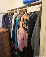 Closet rod with first group of assorted garments