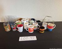 Group shot showing all mugs, glasses and wire rack