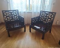 Pair of rosewood lattice armchairs front view