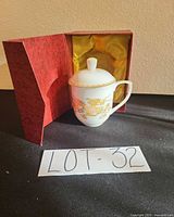 Mug with lid inside red presentation box