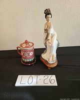 overall view: figurine, tea mug on stand