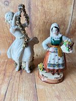 Front view of both porcelain figurines