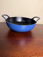 Blue Le Creuset Balti dish side view showing exterior color and shape