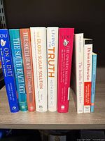 Front spines of nine health and diet books on shelf