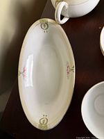 oval relish dish with ribbon and floral pattern