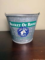 Front view showing Rolling Rock Bucket Of Rocks graphics