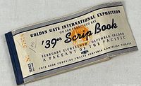 Front cover of 1939 Scrip Book showing title, event details, serial number, and wear