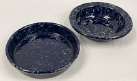 Both Blue Agate stoneware pieces—bowl and pie plate—top view