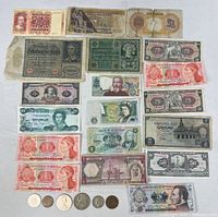 Full arrangement of banknotes and coins on white background