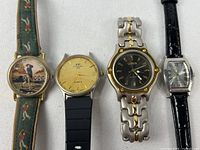 Front view of four wristwatches side by side