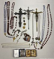 Full layout showing crucifixes, rosaries, medals and accessories