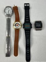 Group shot of four wristwatches aligned