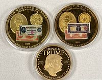 Group shot of all three commemorative coins in capsules
