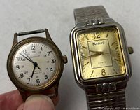 Both watches side by side showing faces and size comparison