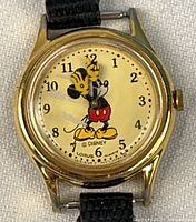 Front view of Lorus Mickey Mouse wristwatch showing dial and hands