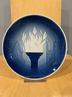 Front view of blue-and-white 1976 Montreal Olympic Games plate