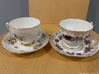 Front view of both teacup and saucer sets