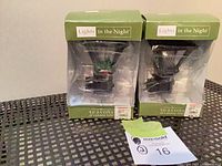 Front view of both boxed "Lights in the Night" night lights