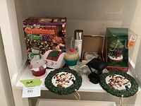 Group shot of boxed FX controller, animated ornament, cupcake lights, snowman night light, wreath ornament hooks and accessory pieces