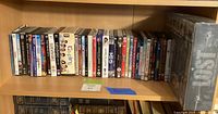 Full shelf view including sealed LOST box set and multiple DVD/Blu-ray cases