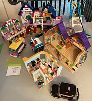 Overall view of assembled LEGO builds and vehicles