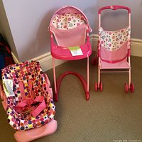 Group shot of car seat, high chair, stroller