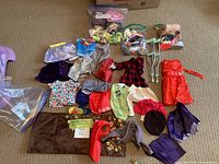 overview of all clothing items, bags, accessories and crutches spread on floor