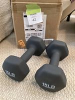 Pair of 15 lb hex dumbbells with shipping box