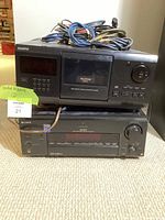 Front view of both Sony components stacked with cables on top