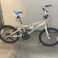 Full left side view of white 20" Nakamura kids mountain bike