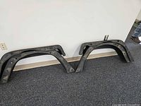 inner side of two rear flares showing mounting holes