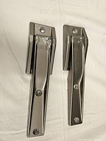 Front view of the two silver-painted Jeep hinges