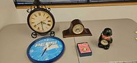 Group shot of all five clocks