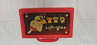 Closed red plastic Hello Kitty case front view