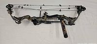 Full view of Diamond Triumph compound bow with stabilizer and sight attached