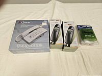 Group shot of all four packaged telephone items