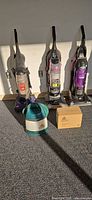 Full set of five appliances: three uprights, Little Green extractor, boxed SteamShot