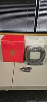 Mini CRT television in plastic with box and cord