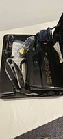 Camcorder and accessories arranged inside open hard case