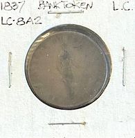 Obverse side of 1837 Lower Canada Bank Token in holder