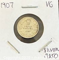 Reverse of 1907 Canadian 10-cent coin in holder showing denomination and wreath