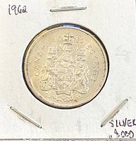 Reverse side showing Canadian coat of arms, denomination, year