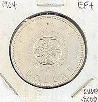 Reverse side of 1964 Charlottetown-Quebec silver dollar in holder