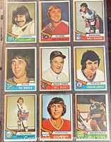 Fronts of all nine hockey cards in a nine-pocket sheet