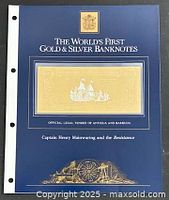 Presentation folder with embedded gold foil banknote visible