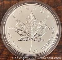 Reverse of coin showing maple leaf design, denomination, purity, weight