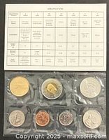 Front view showing all seven coins in sealed packaging with specification card