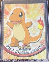 Front of Topps #04 Charmander card in sleeve